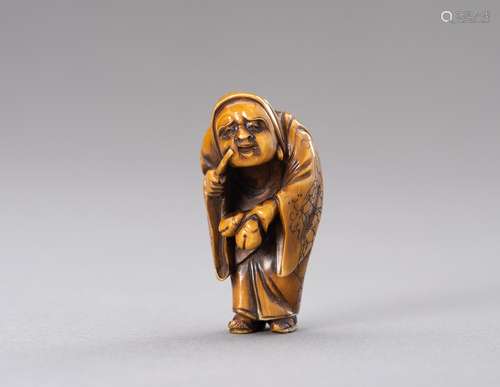 Ɏ A STAINED IVORY NETSUKE OF DARUMA