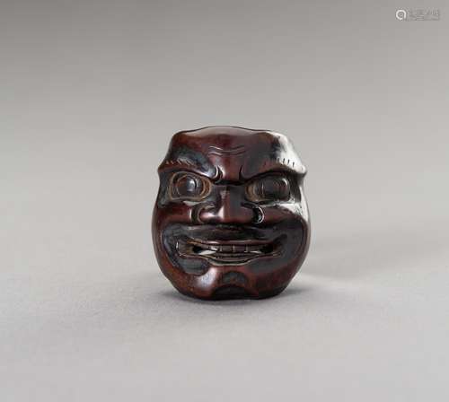 A WOOD MASK NETSUKE OF RAIDEN