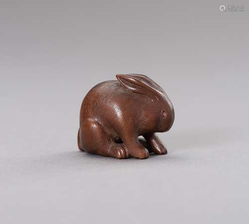 A WOOD NETSUKE OF A RABBIT