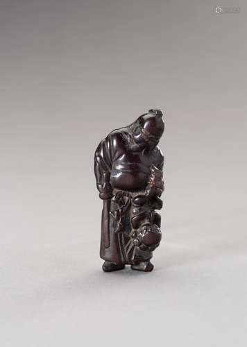 A WOOD NETSUKE OF SHOKI AND ONI