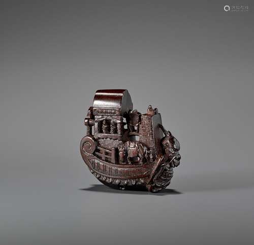 A WOOD NETSUKE OF TRAVELERS IN A SHIP ATTRIBUTED TO KAGETOSH...