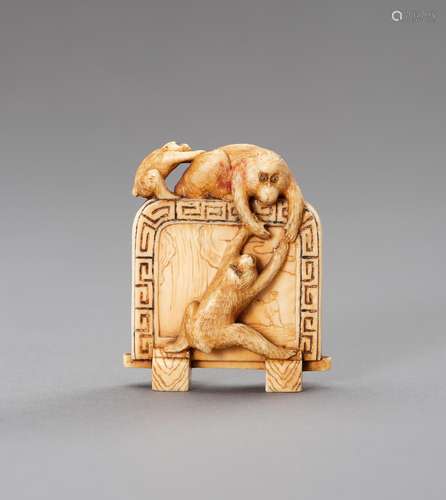 Ɏ AN IVORY NETSUKE DEPICTING THREE MONKEYS CLIMBING ON A SCR...