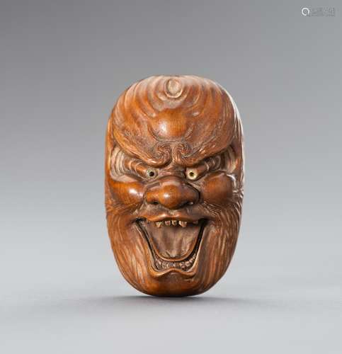 HOZAN: A LARGE WOOD NETSUKE OF A BAKEMONO MASK