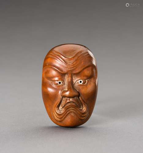 HOZAN: A WOOD NETSUKE OF A BAKEMONO MASK