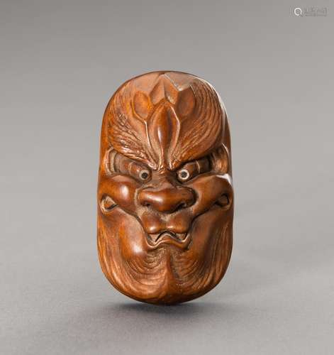 HOZAN: A WOOD SHUNGA NETSUKE OF A BAKEMONO MASK