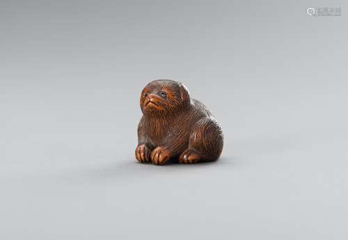 RIMU: A WOOD NETSUKE OF A PUPPY