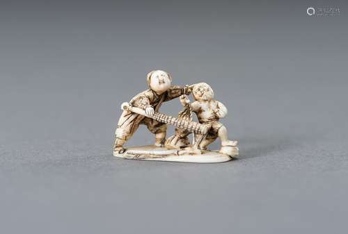 Ɏ TOMOCHIKA: A MINIATURE IVORY NETSUKE OF A WARRIOR CAPTURIN...