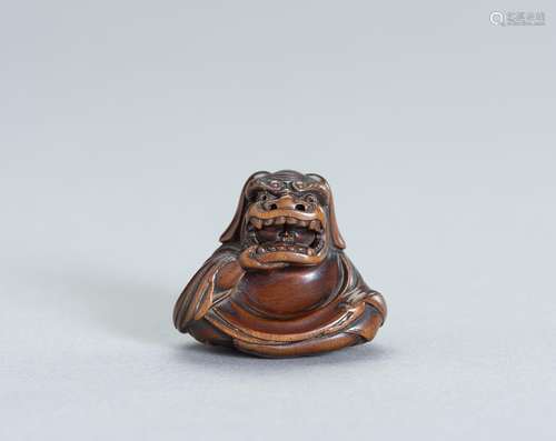 A FINE WOOD NETSUKE OF A SHISHIMAI DANCER