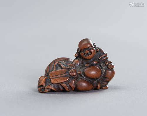 A WOOD NETSUKE OF HOTEI