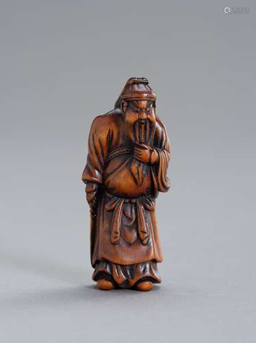 A WOOD NETSUKE OF KAN'U