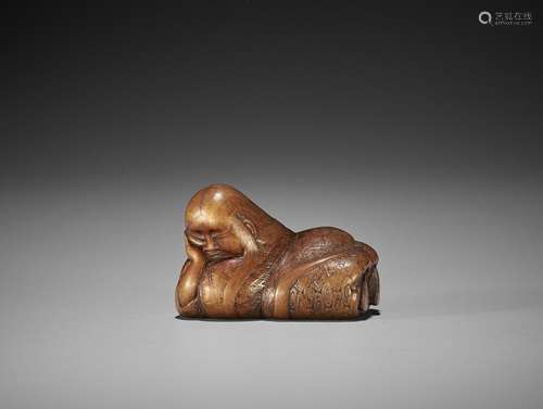 A FINE NAGOYA SCHOOL WOOD NETSUKE OF A SLEEPING SHOJO