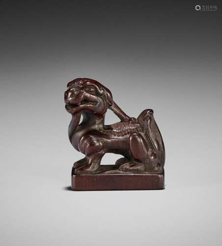 A RARE WOOD NETSUKE OF A SUISEI