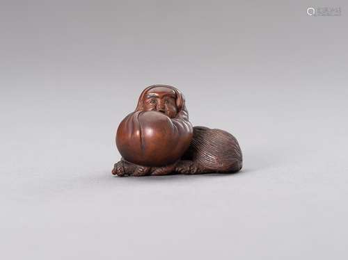 TENZAN: A BOXWOOD NETSUKE OF A DARUMA