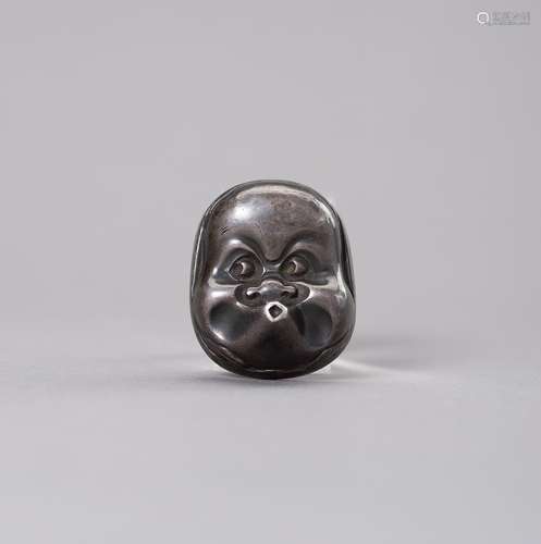 A SILVER HYOTTOKO MASK NETSUKE