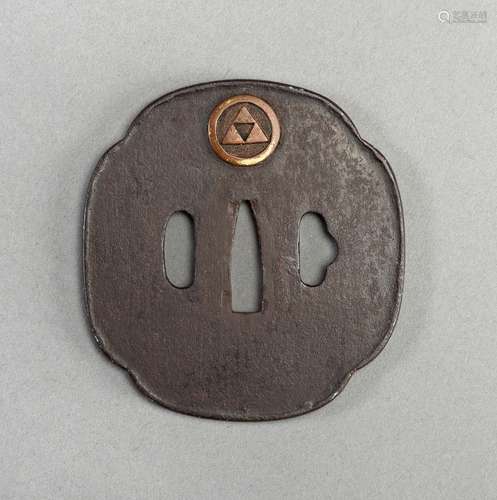 AN IRON TSUBA WITH EMBLEM