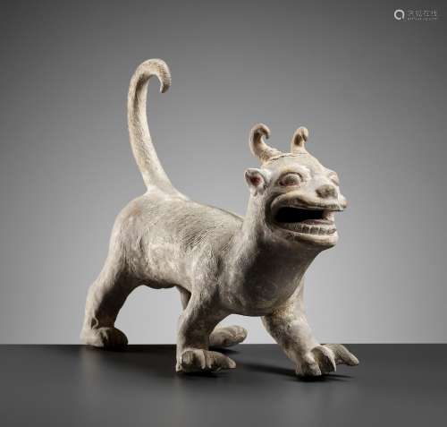 A PAINTED POTTERY FIGURE OF A MYTHICAL BEAST, LATE EASTERN H...