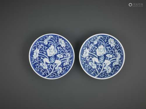 A NEAR-PAIR OF BLUE AND WHITE 'LOTUS BOY' DISHES, ...