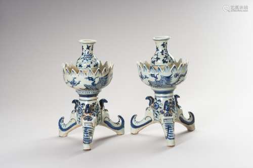 A PAIR OF MING STYLE BLUE AND WHITE CANDLE HOLDERS