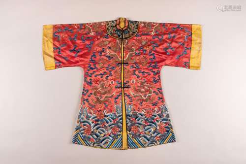 A RED GROUND EMBROIDERED SILK ROBE, QING