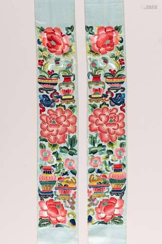 A PAIR OF PALE TURQUOISE 'PEONY' SILK SLEEVE BANDS...