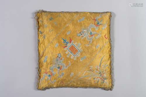 A YELLOW SILK CUSHION WITH DRAGONS