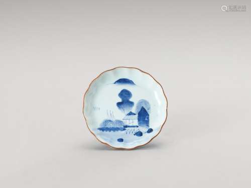 † A SMALL BLUE AND WHITE LOBED PORCELAIN DISH