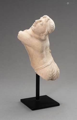 A STUCCO TORSO OF A MALE ADORANT, GANDHARA