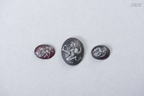 A SET OF THREE CARVED INTAGLIO SEALS