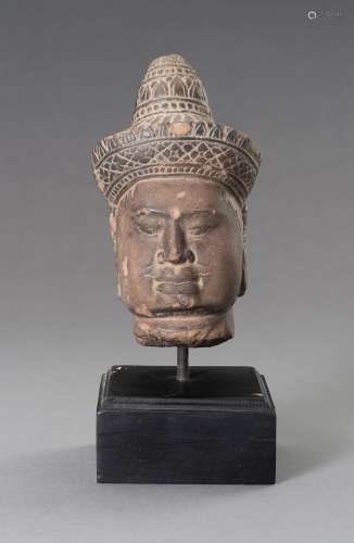 A STONEWARE MUSEUM COPY OF A KHMER HEAD