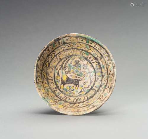 A NISHAPUR 'IBEX AND BEAST' POTTERY BOWL, 9TH - 10...