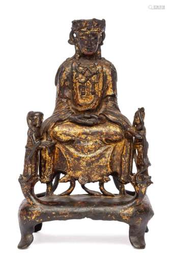 A Chinese Ming bronze figure of Guanyin with two children