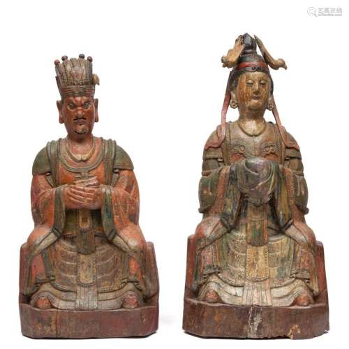 A pair of polychromed wood figures