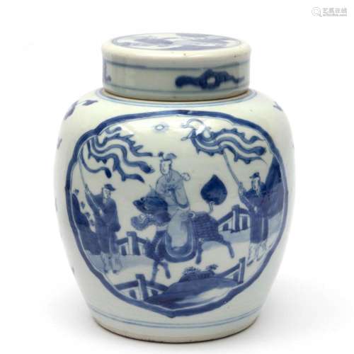 A blue and white lidded pot with figures