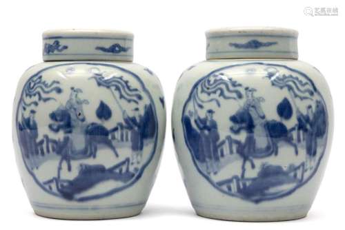 Two blue and white lidded pots with figures