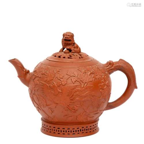 A globular Yixing teapot with relief decoration