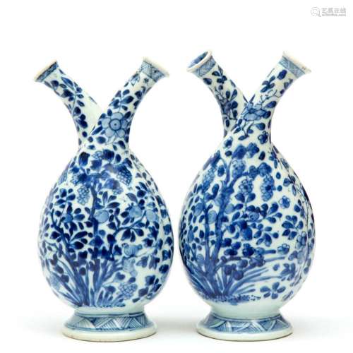 A pair of blue and white double-bodied cruet bottles