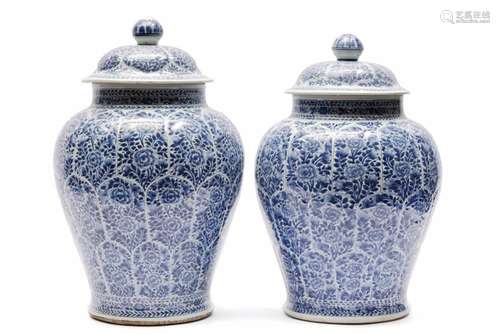 Two large blue and white covered vases