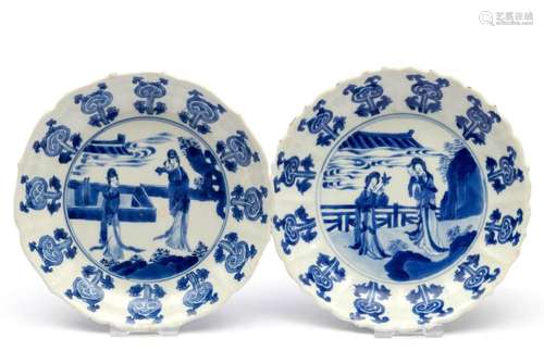 Two blue and white plates with figures