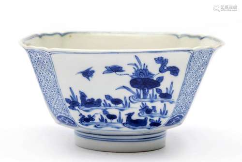 A blue and white squared floral bowl