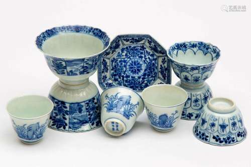 Various blue and white cups and a saucer