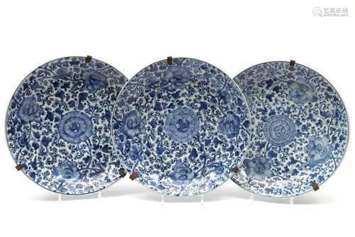 Three large blue and white peony chargers