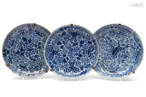 Three large blue and white scrolling lotus chargers