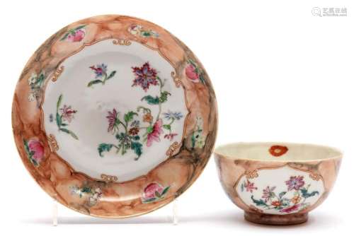 A faux-marble famille rose cup and saucer