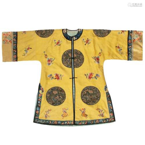 A Chinese manchu style yellow silk ladies robe