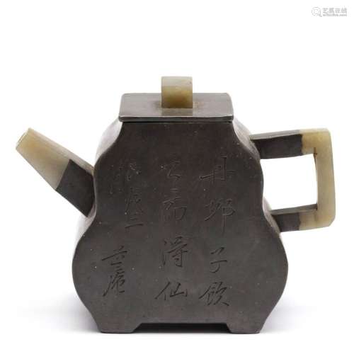 A Yixing pottery teapot with pewter covering