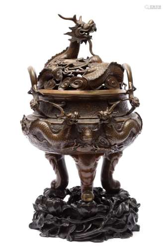 A large Chinese dragon censer on wooden stand