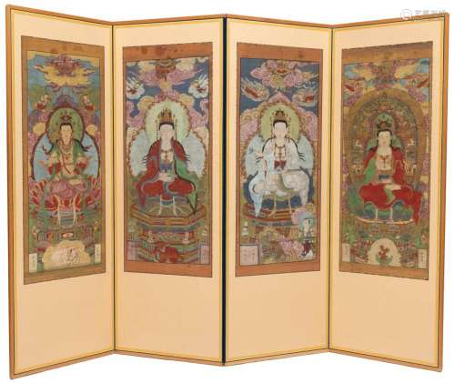 A large folding screen with paintings of guanyins