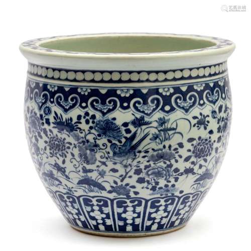 A large blue and white round jardiniere