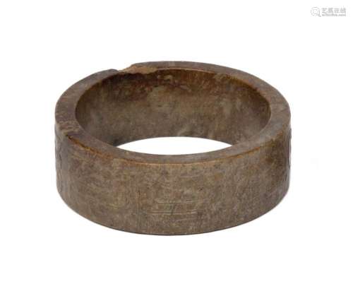 A hardstone bangle with archaic motif