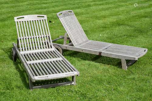 A PAIR OF HARDWOOD STEAMER RECLINERS